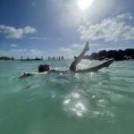 Gluten-free Traveling Family Trio enjoying a swim in Bahamas