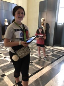 Gluten-Free Traveling Trio Family in Rome exploring museums with audio tour