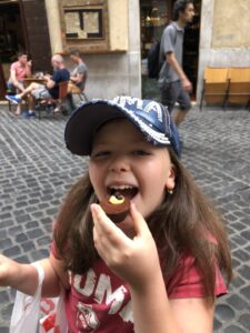 Gluten-Free Traveling Trio Family in Rome eating gluten-free chocolates