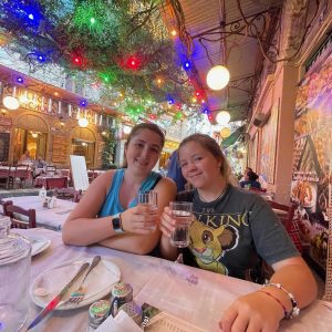 Traveling Trio Family waiting for dinner in Athens Greece