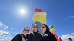 Gluten-free Traveling Family Trio taking picture by Seven Magic Mountains, Nevada