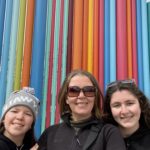 Gluten-free Traveling Family Trio taking picture by Smith Center Pipe Dream Sculpture, Las Vegas