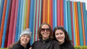 Gluten-free Traveling Family Trio taking picture by Smith Center Pipe Dream Sculpture, Las Vegas