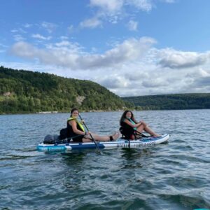 Gluten-free Traveling Trio Family paddleboarding in Devil's Lake, Wisconsin