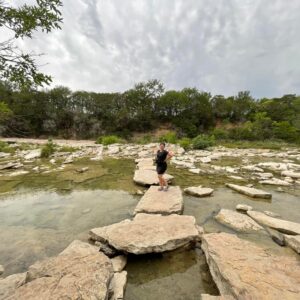 Traveling Trio Family taking a picture in Dinosaur State Park, Texas