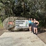 Traveling Trio Family next to the Everglades National Park Sign